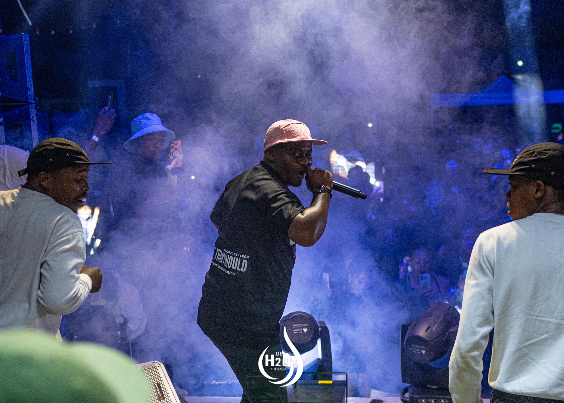MC performing on stage with smoke effects